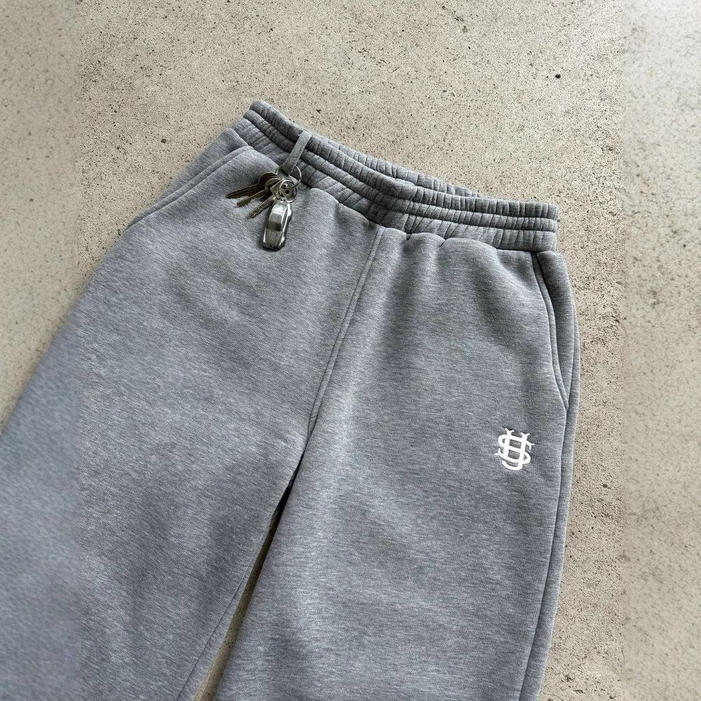Pantalón de chándal con cremallera de color liso