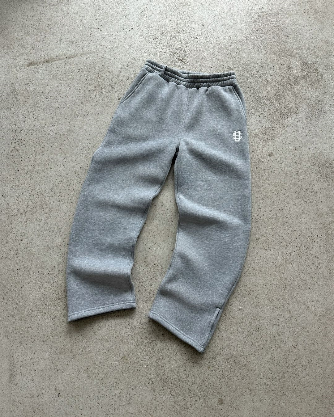 Pantalón de chándal con cremallera de color liso