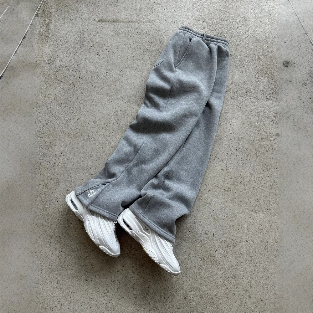 Pantalón de chándal con cremallera de color liso